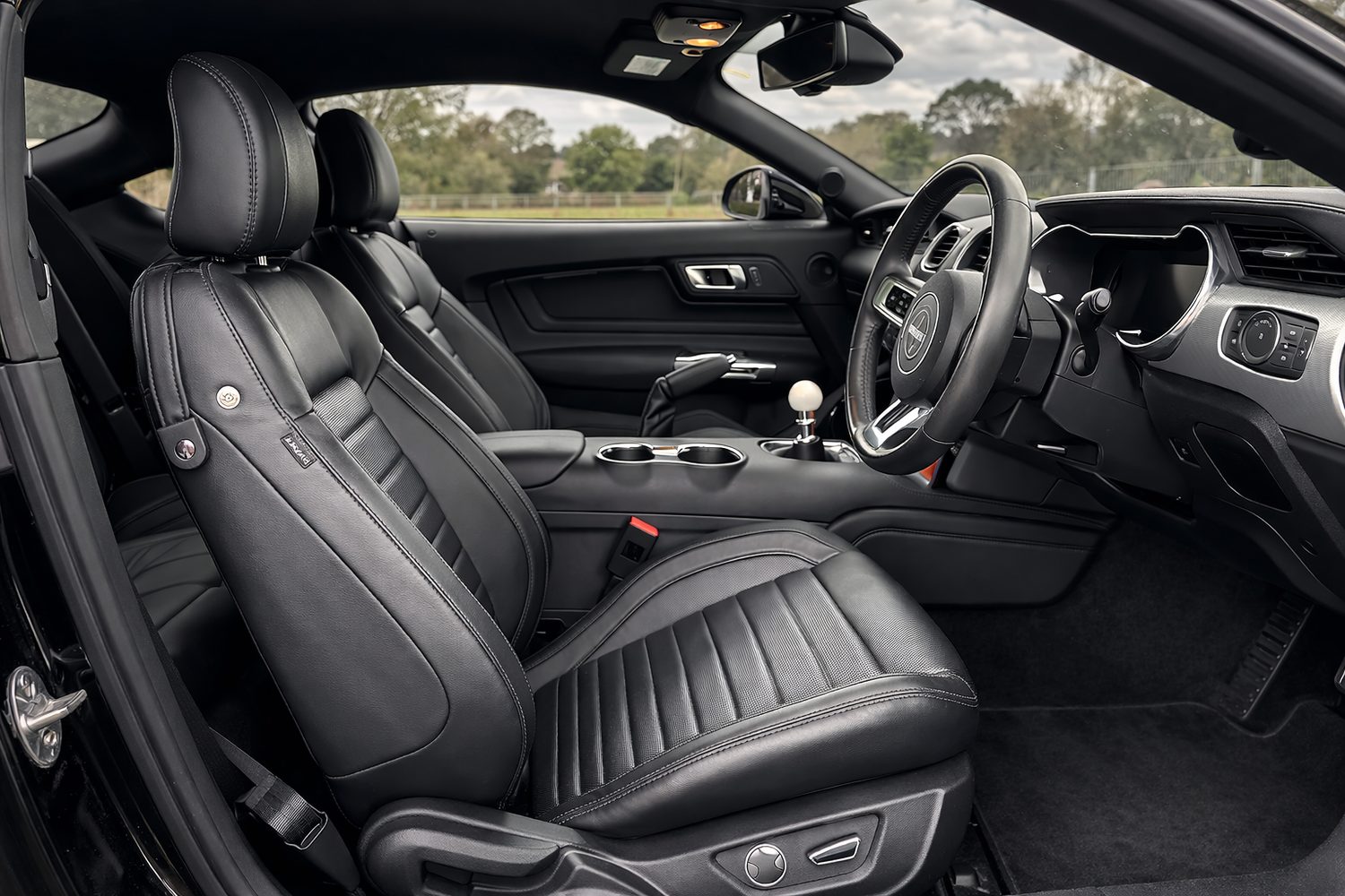 Black leather car interior cleaned and dressed by Shire Auto Clean